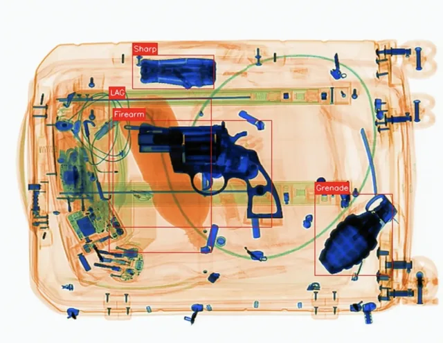 AI X-ray scan automatically detecting a firearm and grenade