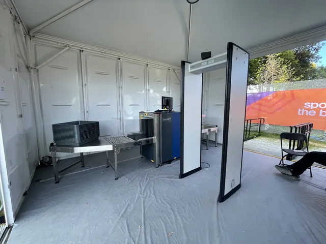 Walk-through metal detectors, X-ray lanes and search tables at a Commonwealth Games checkpoint