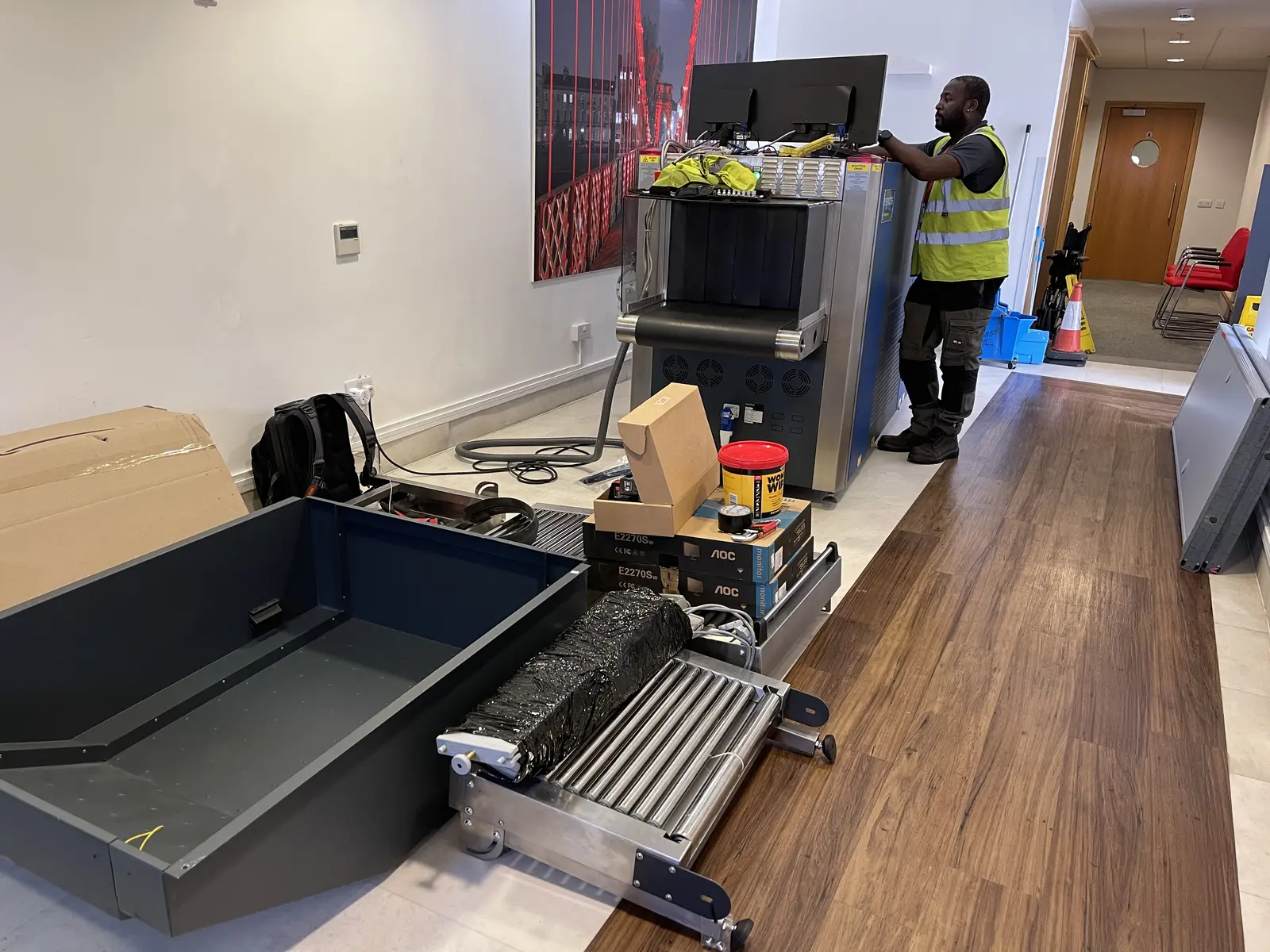 RedteQ engineer setting up an X-ray machine on a customer site ready for operator training