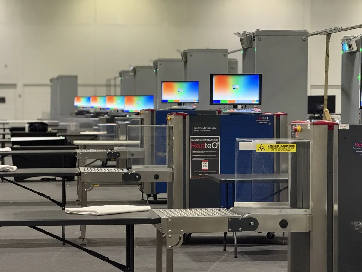 Rows of hired X-ray screening lanes at a large event hall