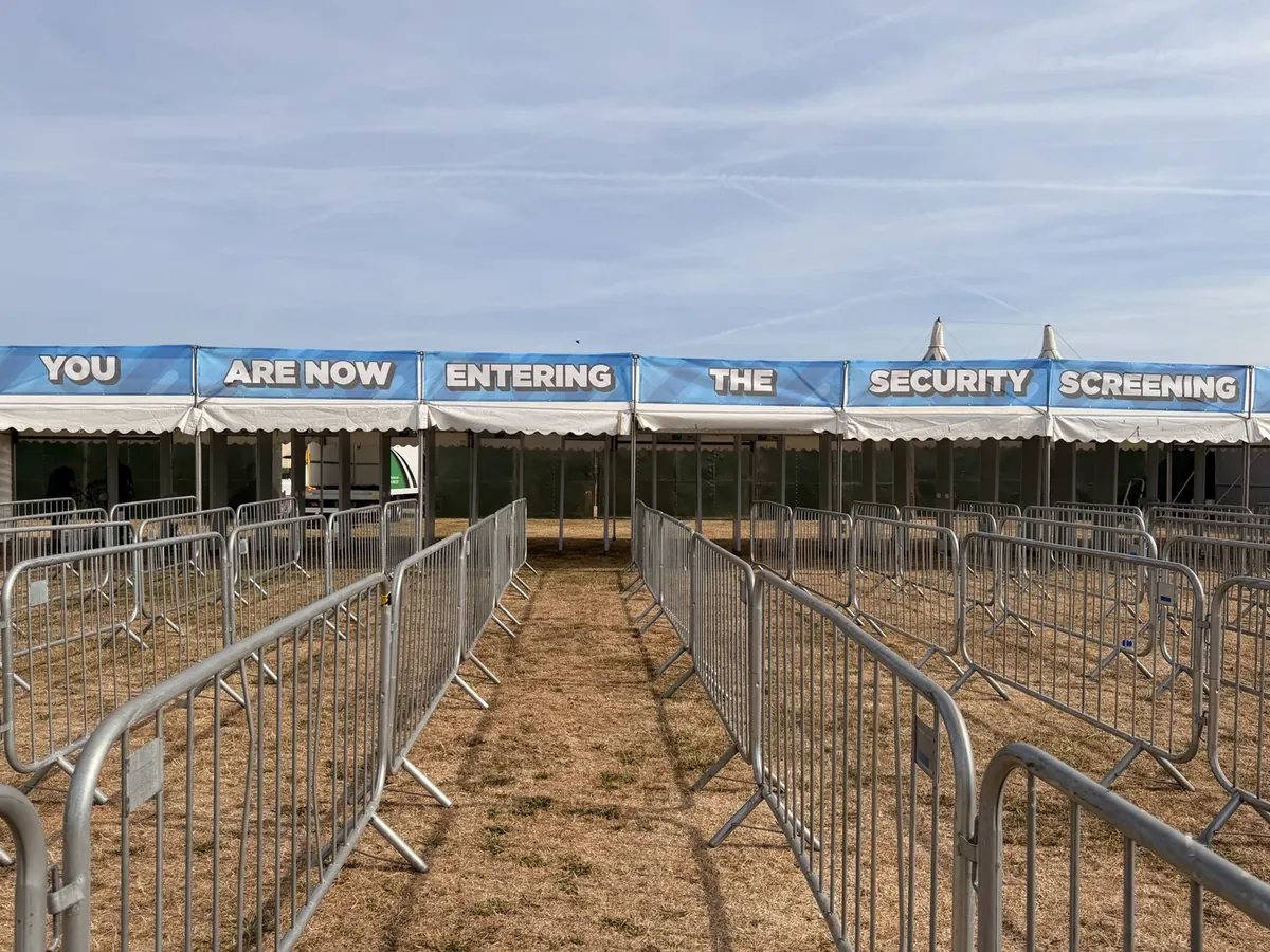 Signed security screening entrance built from RedteQ hire equipment at a UK event