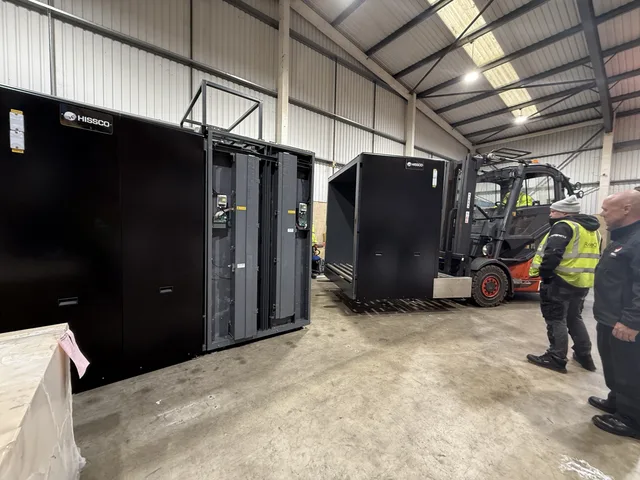 RedteQ engineers building the second cargo X-ray system using the hired forklift