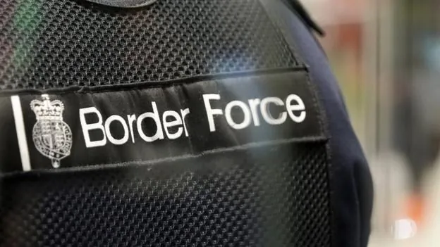 Border Force officer insignia during a border control operation