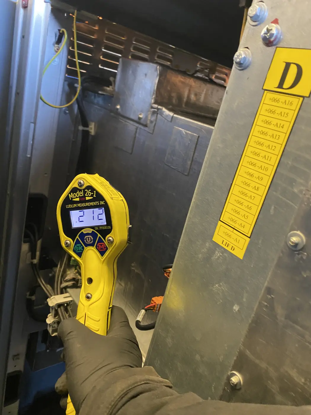 RedteQ engineer taking dose-rate measurements around an X-ray machine during a radiation survey